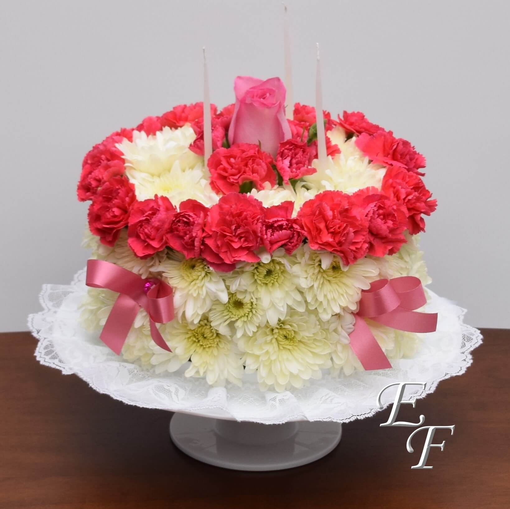 Floral arrangement shaped like a birthday cake