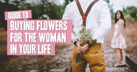 Man with bouquet behind his back to surprise a woman
