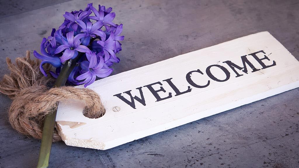 Blue Hyacinth flowers with a welcome tag